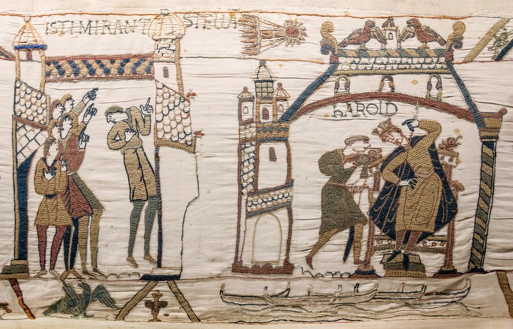 Scene 32 of the Bayeux Tapestry: men point at Halley's Comet while Harold, newly crowned, is told of it. Image via rawpixel, CC0
