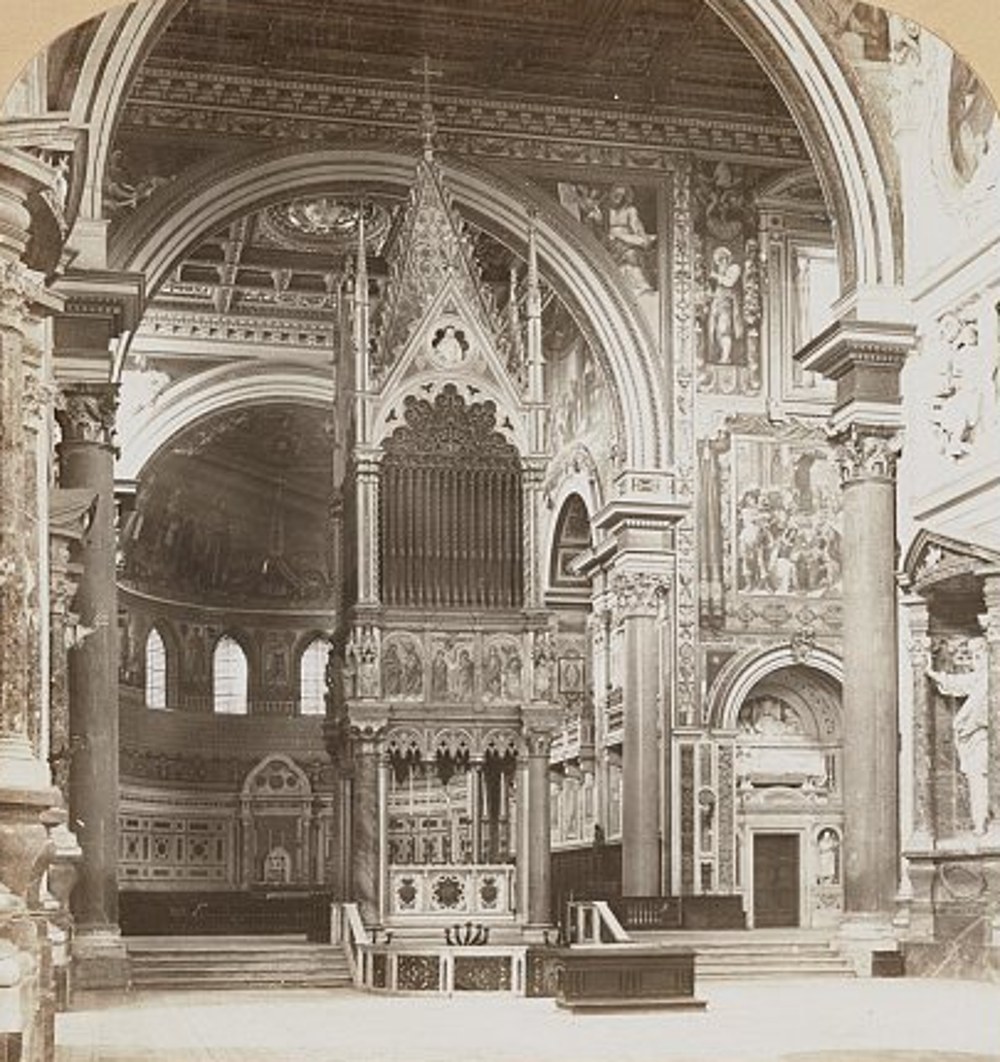 Sepia photograph from 1902 of the interior of the basilica of St John Lateran in Rome, looking toward the Gothic canopy over the high altar