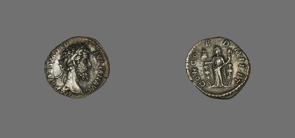 Silver denarius of Didius Julianus, 193 AD: the emperor's laureate head on one side, the figure of Concordia with military standards on the other