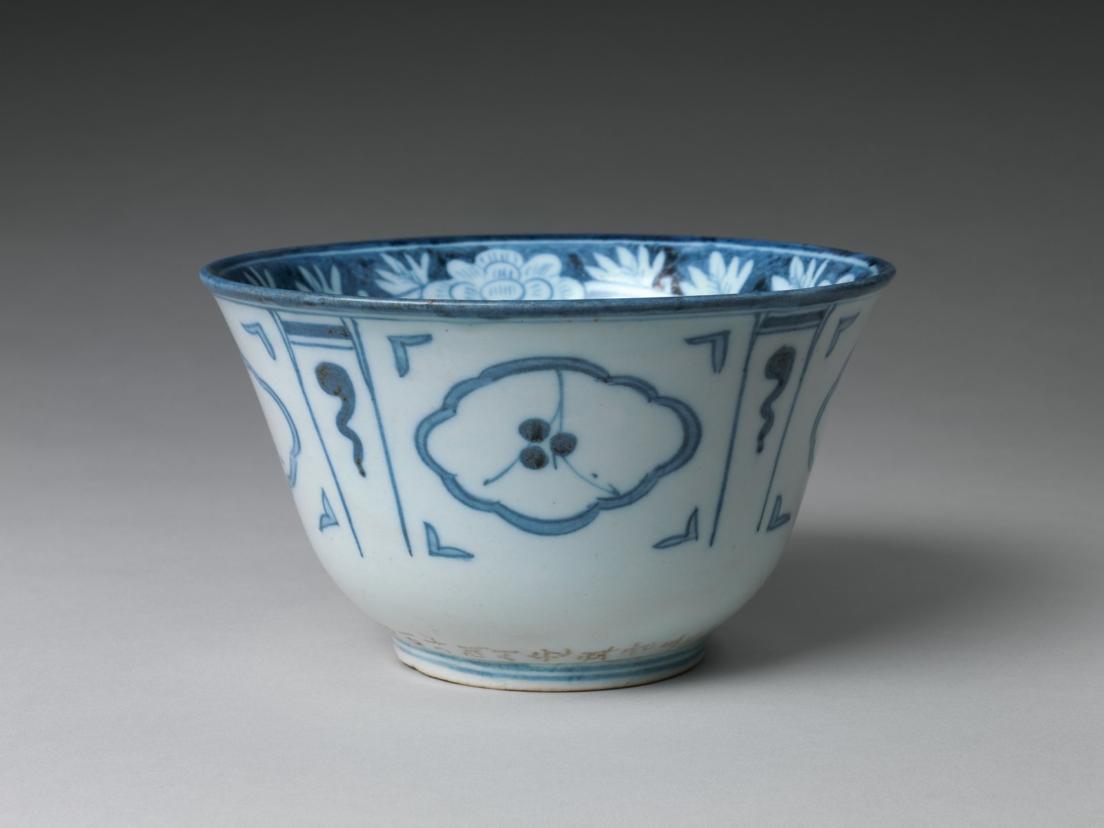 Blue and white porcelain bowl from Joseon-dynasty Korea, dated 1847, with floral panels and an inscription incised around the foot