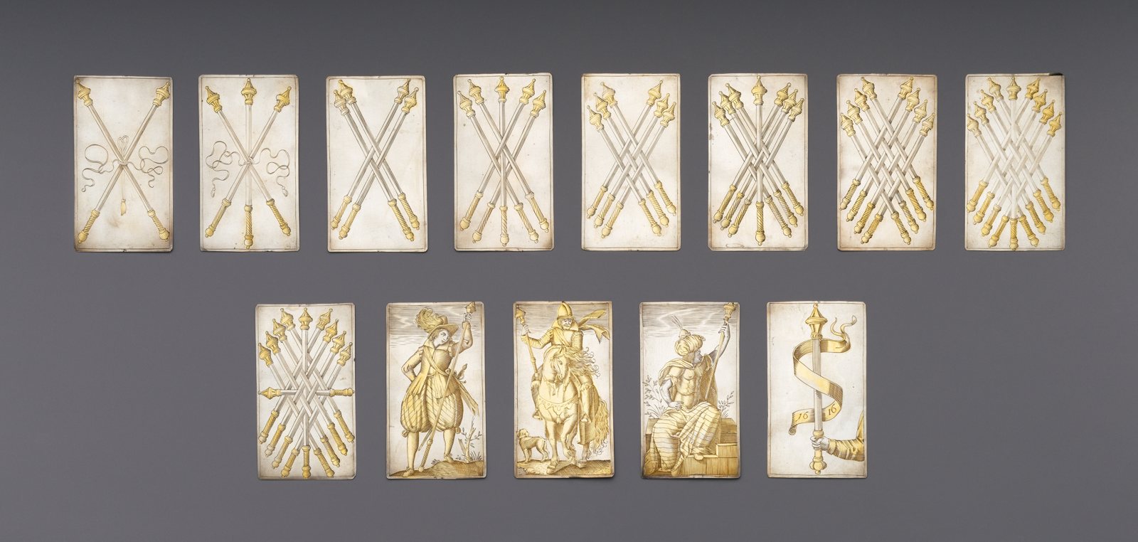 A suit of batons from a set of engraved silver playing cards made by Michael Frömmer in 1616. The Metropolitan Museum of Art, CC0