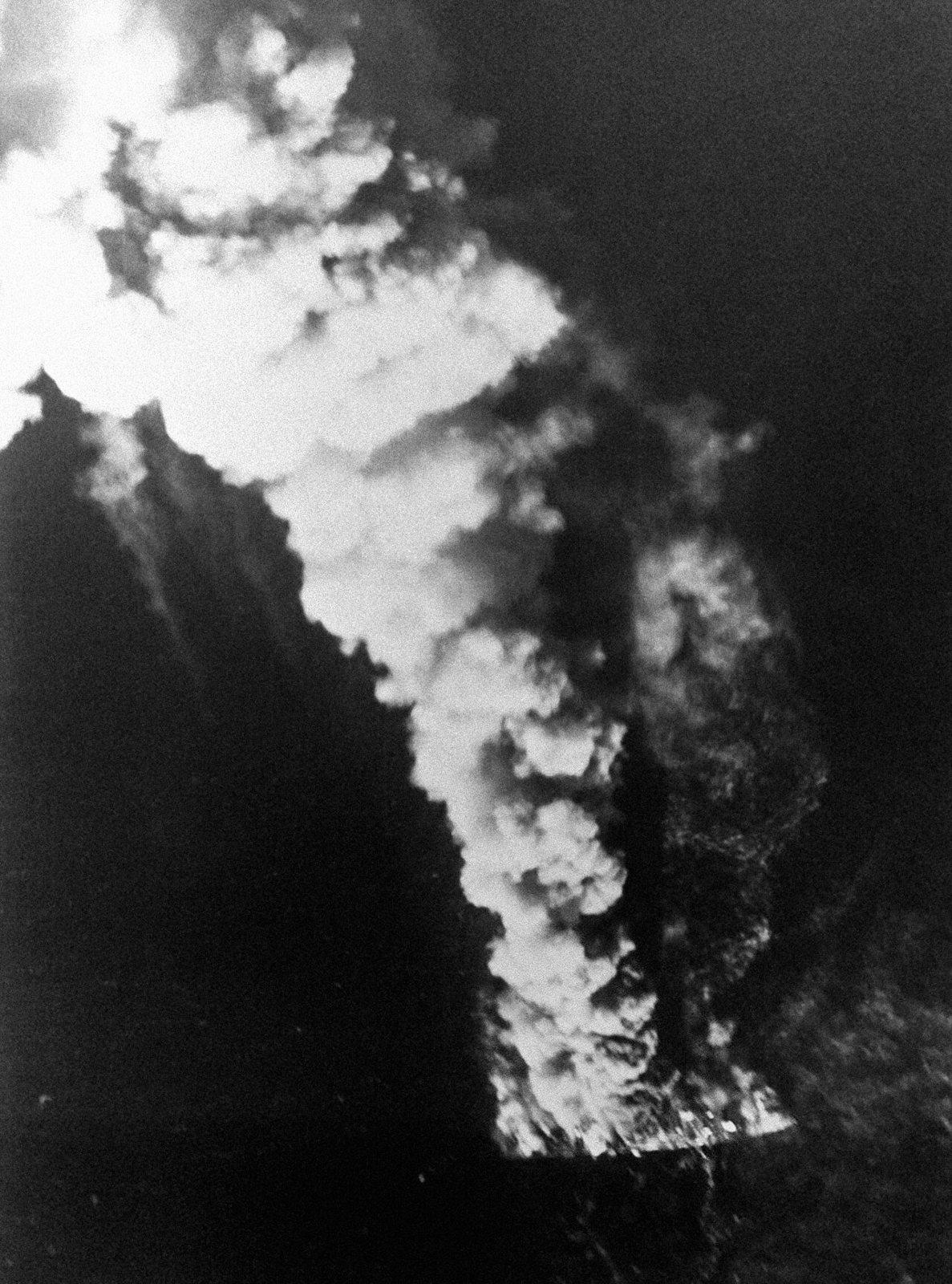 Aerial photograph of a column of black smoke rising from the Iranian frigate Sahand after the US air attack of 18 April 1988. US Navy photo, public domain, via Wikimedia Commons
