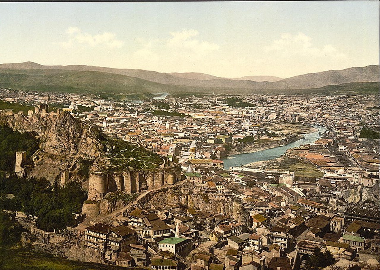 Photochrom print of Tiflis (Tbilisi) around 1890 to 1900, showing the old fortress on its ridge above the town and the river