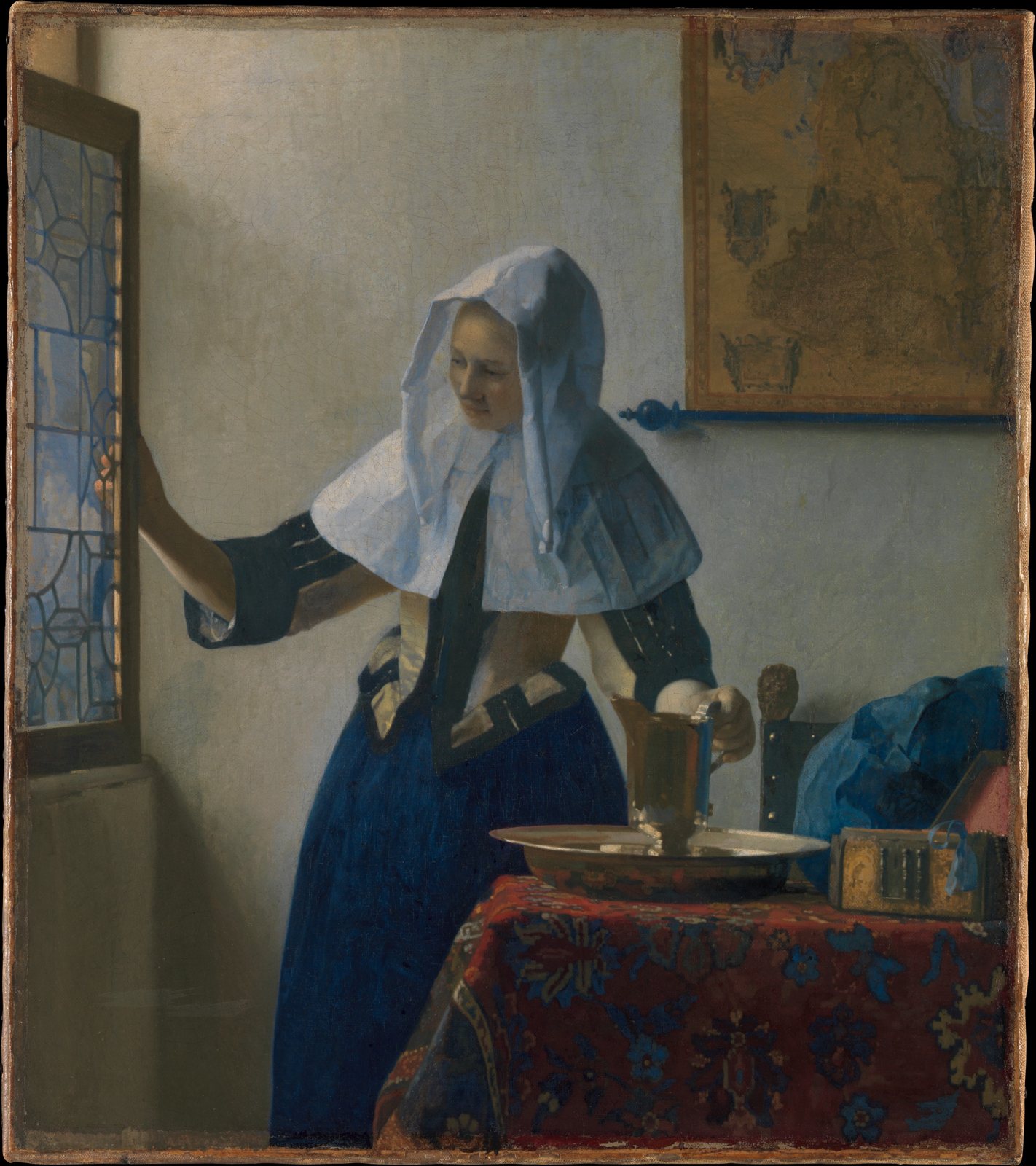 Johannes Vermeer's painting Young Woman with a Water Pitcher (about 1662): a woman in a white headdress and a deep blue ultramarine skirt stands by a window holding a brass pitcher
