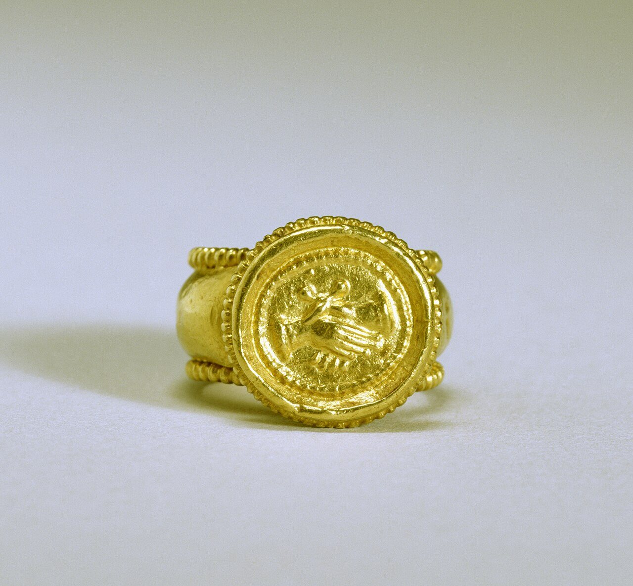 Byzantine gold marriage ring with two clasped hands on the bezel. Walters Art Museum, public domain, via Wikimedia Commons