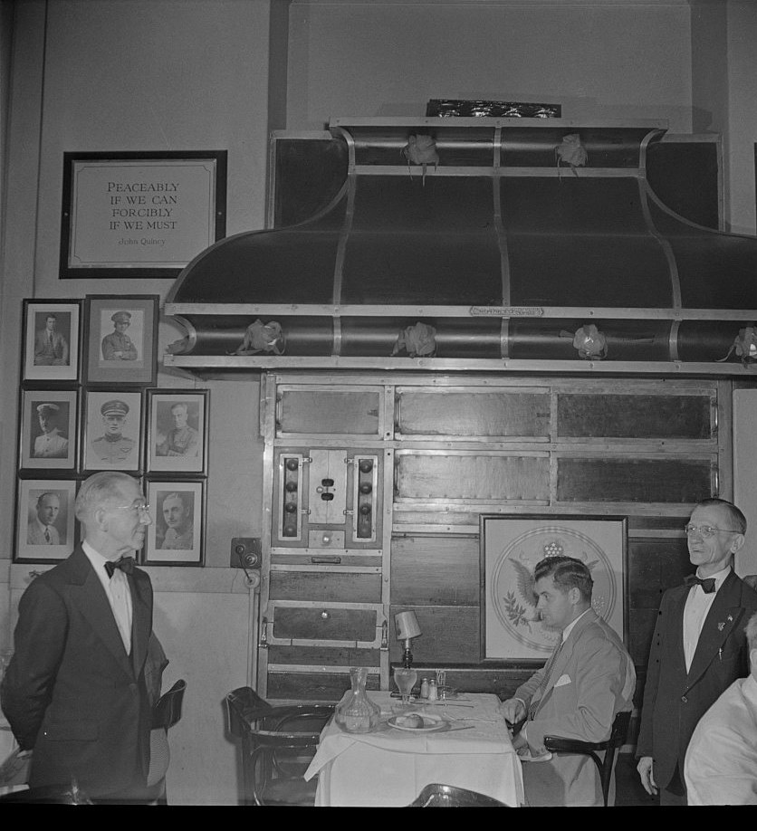 Photograph of a head waiter, a waiter and a diner at the Occidental Hotel restaurant in Washington, D.C., 1942
