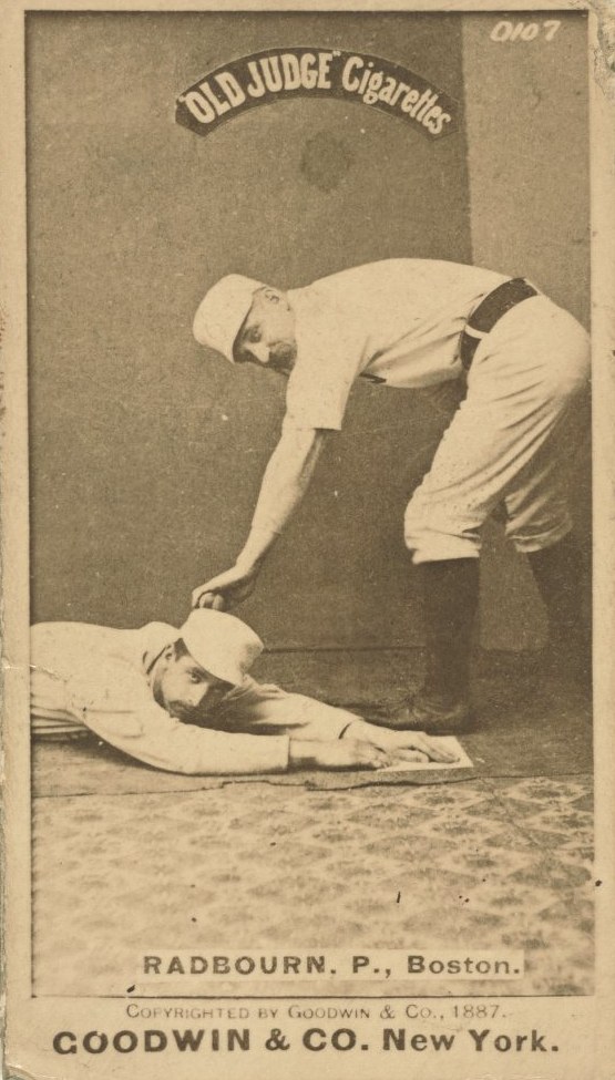 Old Judge Cigarettes baseball card of pitcher Charles Radbourn in a Boston uniform tagging a sliding runner, 1887
